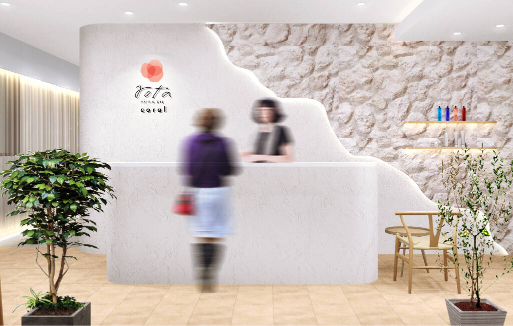 美容院の受付カウンターで対応するスタッフと来店客の様子